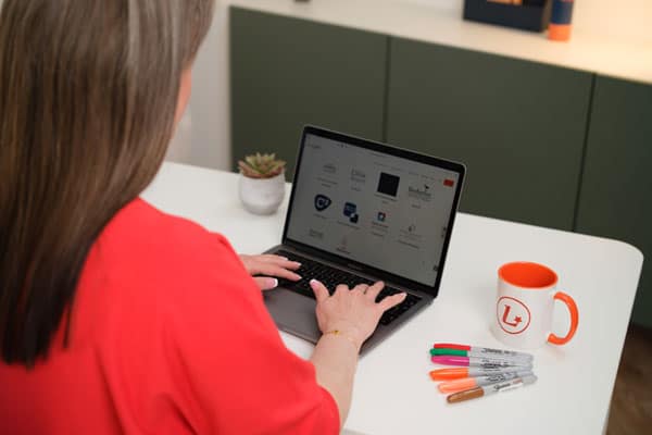 Louise Maggs looking at her website